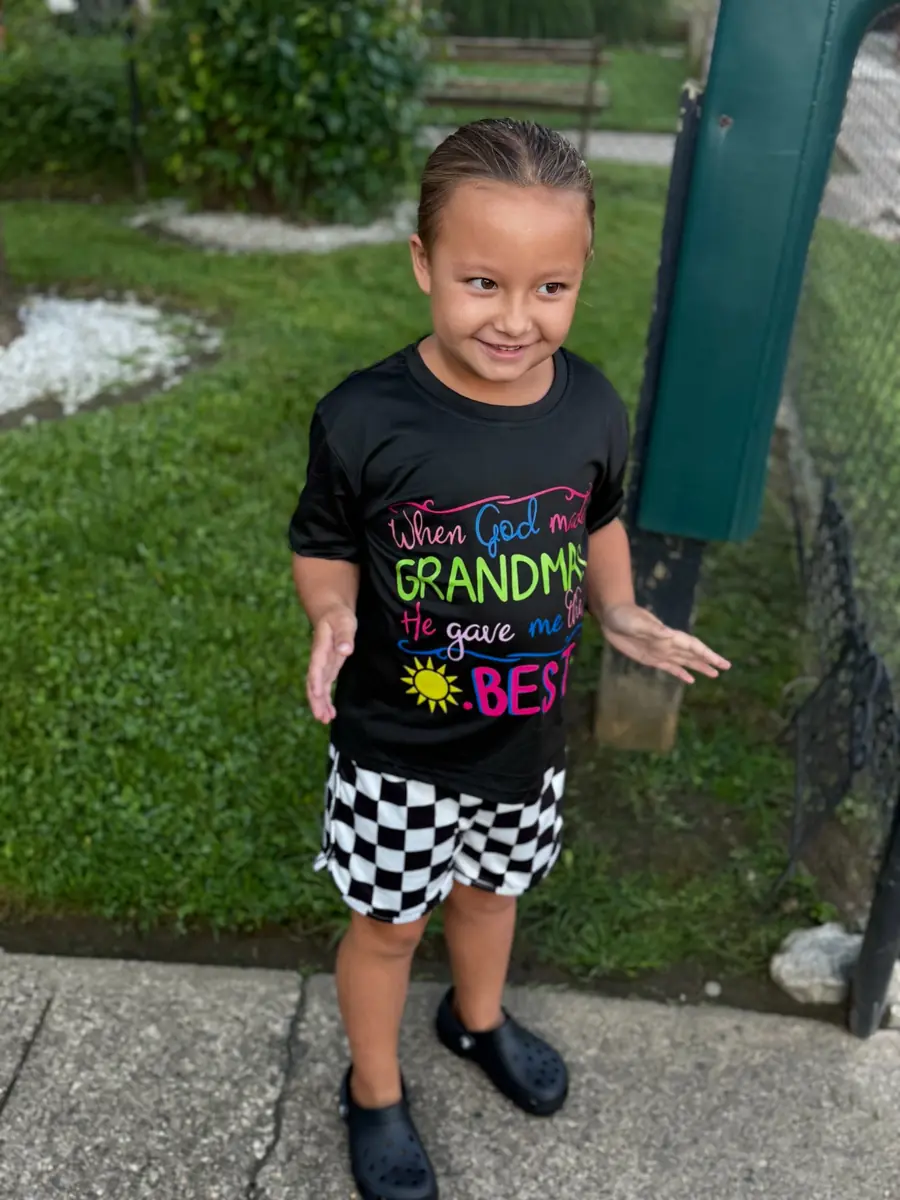 Krymsyn smiling outdoors in a garden setting